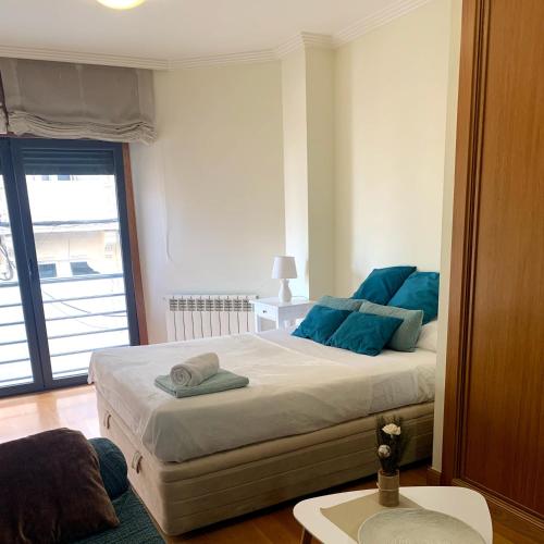 A bed or beds in a room at estudio centro vigo