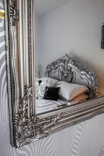 a reflection of a bed in a mirror at Ugthorpe Lodge Hotel in Whitby