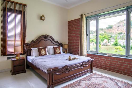 En eller flere senge i et værelse på StayVista at Hillside Paradise
