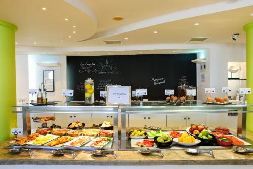 a buffet line with many different types of food at Golden Star City Resort in Perea