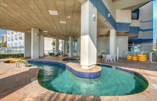 a swimming pool in the middle of a building at Carolinian Corner Gem Views! in Myrtle Beach