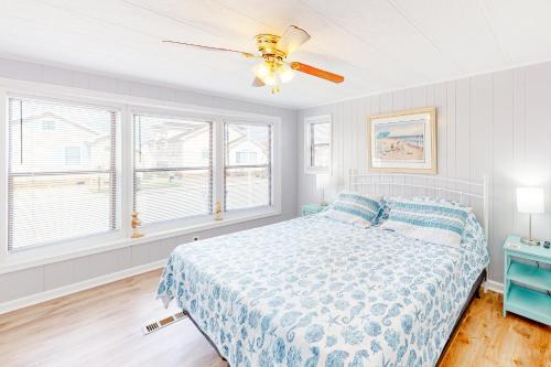 a bedroom with a bed and a ceiling fan at Montego Bay - Sea Lane in Ocean City