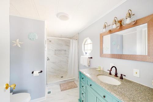a bathroom with a sink and a shower at Montego Bay - Sea Lane in Ocean City