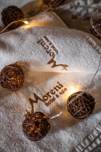 a close up of a christmas ornament on a towel at Hotel and SPA Moreni in Sofia