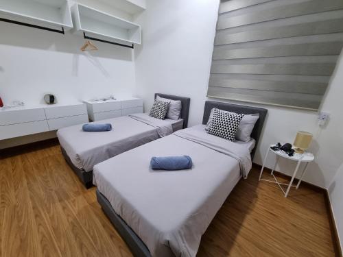 Postel nebo postele na pokoji v ubytování Lavish Beacon Executive Suites by Bin Dao Wu Homestay Penang