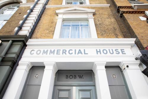 a building with a sign that reads commercial house at Bob W London Spitalfields in London