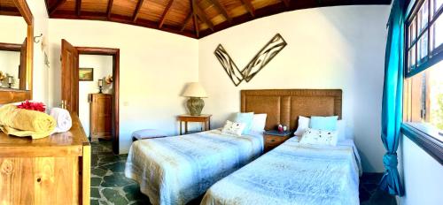 מיטה או מיטות בחדר ב-Finca Chimaca