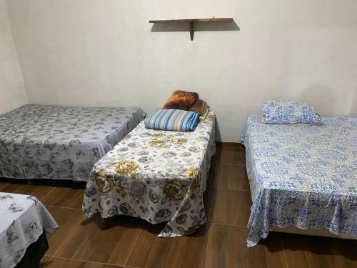 Katil atau katil-katil dalam bilik di Pousada Sitio do Terrão a 500 metros da BR 040 e a 10 minutos da Prainha