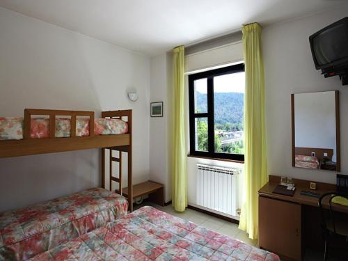 Postel nebo postele na pokoji v ubytování Euro Hotel