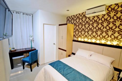 Postel nebo postele na pokoji v ubytování Dom Hotel