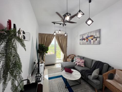 a living room with a couch and a table at Urban Gateway Homestay# Bangi#Wifi 300Mbps#Netflix in Kampong Tangkas
