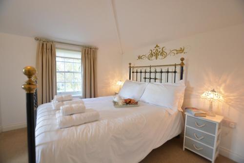 Tempat tidur dalam kamar di Ferry Cottage, Southwold