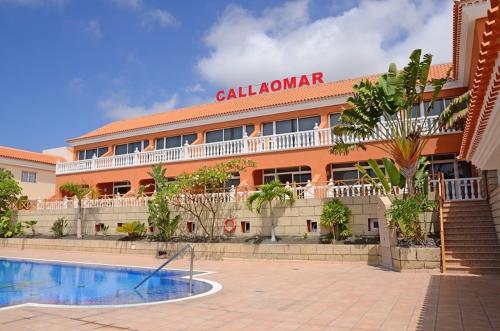 
a large building with a swimming pool in front of it at Apartamentos Callaomar in Callao Salvaje
