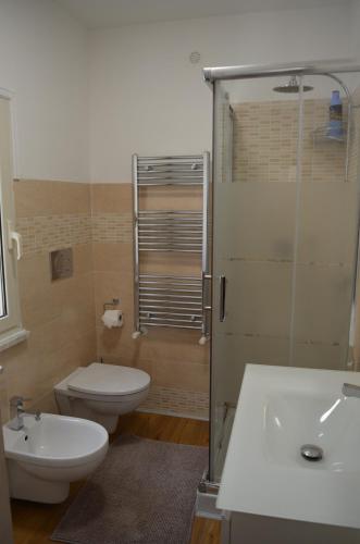 a bathroom with a toilet and a sink and a shower at Casa SoleLuna - alloggio turistico Rome Airport in Fiumicino