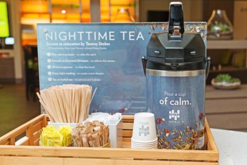 a wooden tray with a korean thermos and chopsticks at EVEN Hotel Omaha Downtown - Old Market by IHG in Omaha