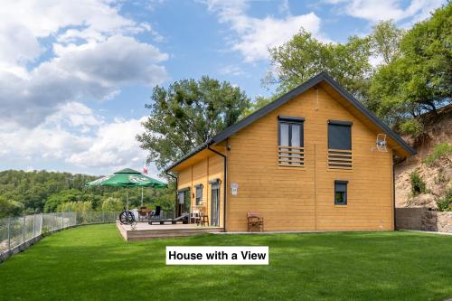 a house with a view with a yard at Houses with a View#Sauna#Jaccuzi in Gozdowice