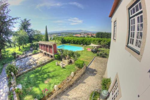 an aerial view of a yard with a swimming pool at Quinta de São Roque in Vila Nova de Cerveira