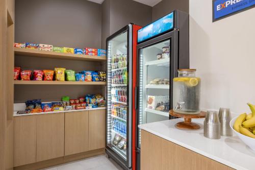 a refrigerator with its door open in a kitchen at Holiday Inn Express & Suites Opelousas by IHG in Opelousas