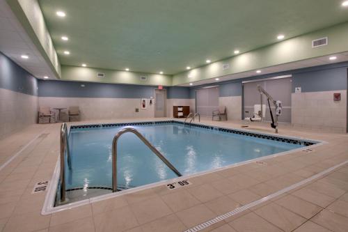 a large swimming pool in a hotel room at Holiday Inn Express & Suites - Mount Vernon, an IHG Hotel in Mount Vernon