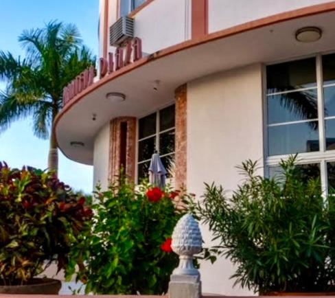 a house with plants in front of it at Mantell Plaza Apartments in Miami Beach