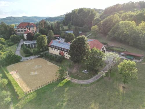 an aerial view of a house with a large yard at Ferienwohnung am Eggegebirge in Bad Driburg