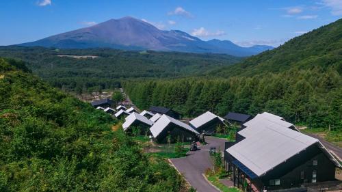 an aerial view of a village in the mountains at Asama Kuzanbo in Naganohara