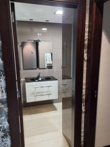 a bathroom with a sink and a mirror at Loft silgar in Sanxenxo