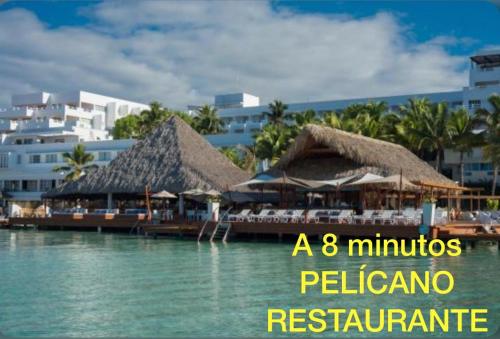 a minutes pelicanican restaurant on the water in a resort at Merengue House in Boca Chica