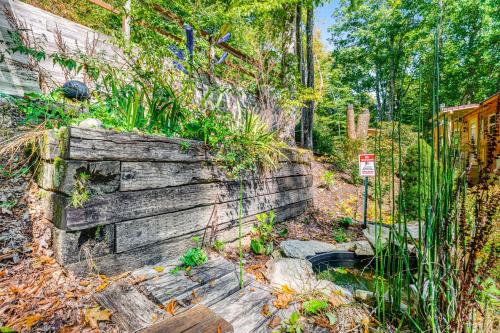 a garden with a wooden retaining wall and plants at Highland Haven in Newland