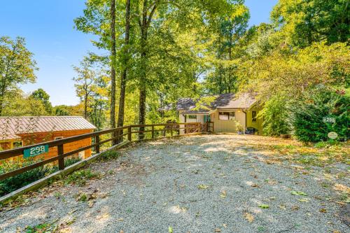 a driveway with a fence and a house at Highland Haven in Newland