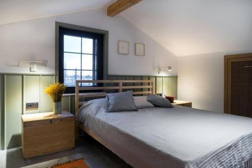 a bedroom with a large bed and a window at Narev Kırkpınar Sapanca in Sapanca
