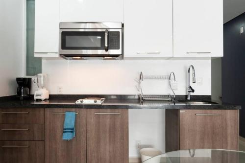 Η κουζίνα ή μικρή κουζίνα στο Nuevo! Loft hermoso con alberca. Wi-Fi Rapido.