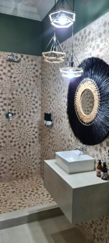a bathroom with a sink and a mirror on the wall at Villa Grande Luxury accommodation in Welkom