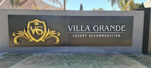 a sign for a villa grande luxury accommodation at Villa Grande Luxury accommodation in Welkom