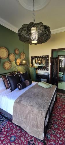 a bedroom with a large bed in a room at Villa Grande Luxury accommodation in Welkom