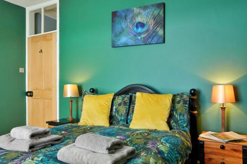 a bedroom with a bed with towels on it at Finest Retreats - Peak View in Two Dales