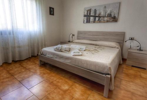 מיטה או מיטות בחדר ב-Casa SteMa