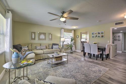 a living room with a couch and a table at 3 Blocks to the Coast! Cozy Sarasota Retreat in Sarasota