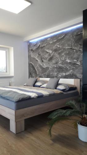 Postel nebo postele na pokoji v ubytování Vila Věkoše - apartmán s terasou a zahradou