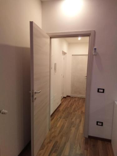 an empty room with a door and a hallway at Katrin luxury in Verona