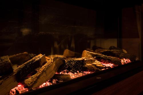 a cake is being cooked in an oven at Villa Inverno & Spa in Kolašin
