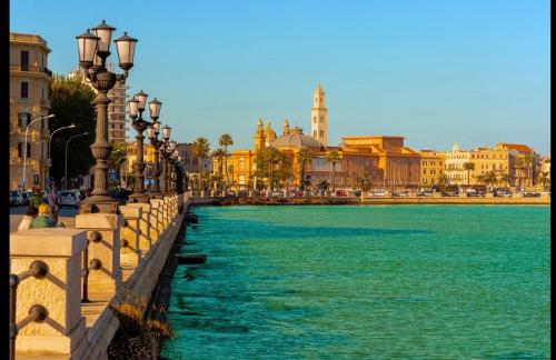 a view of a body of water with buildings and street lights at Case vacanza e camere in Villa Isabella con parcheggio custodito e wifi in Gioia del Colle