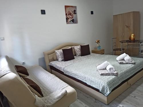 Ένα ή περισσότερα κρεβάτια σε δωμάτιο στο Relax Apartmani Niš