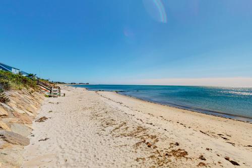a sandy beach with the ocean in the background at Seaside Sanctuary in Harwich