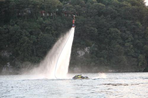 a group of people on a jet ski in the water at Dkamping Village - International Camping Ispra in Ispra