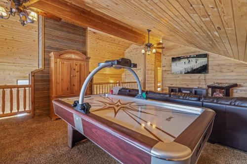 a large room with a hot tub in a cabin at Liberty Lodge by KABINO Hot Tub Air Hockey 3 Living Rooms 7 bedrooms Boat Launch Reservoir ATV Snowmobile Trails WiFi in Island Park