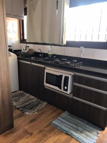Dapur atau dapur kecil di Apartamento com vista para o mar em Capão da Canoa!
