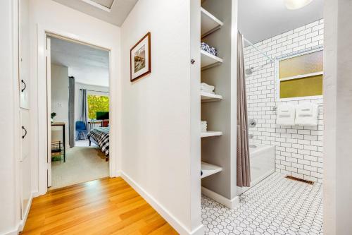 a bathroom with a walk in shower and a walk in closet at Caz Cabin 6 in Cazadero