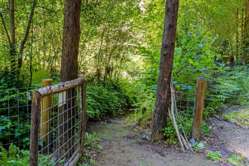 a gate on a trail in the woods at Caz Cabin 6 in Cazadero