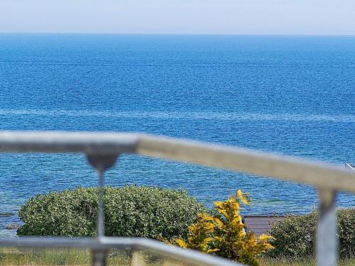 a view of the ocean from a balcony at 6 person holiday home in Allinge in Allinge